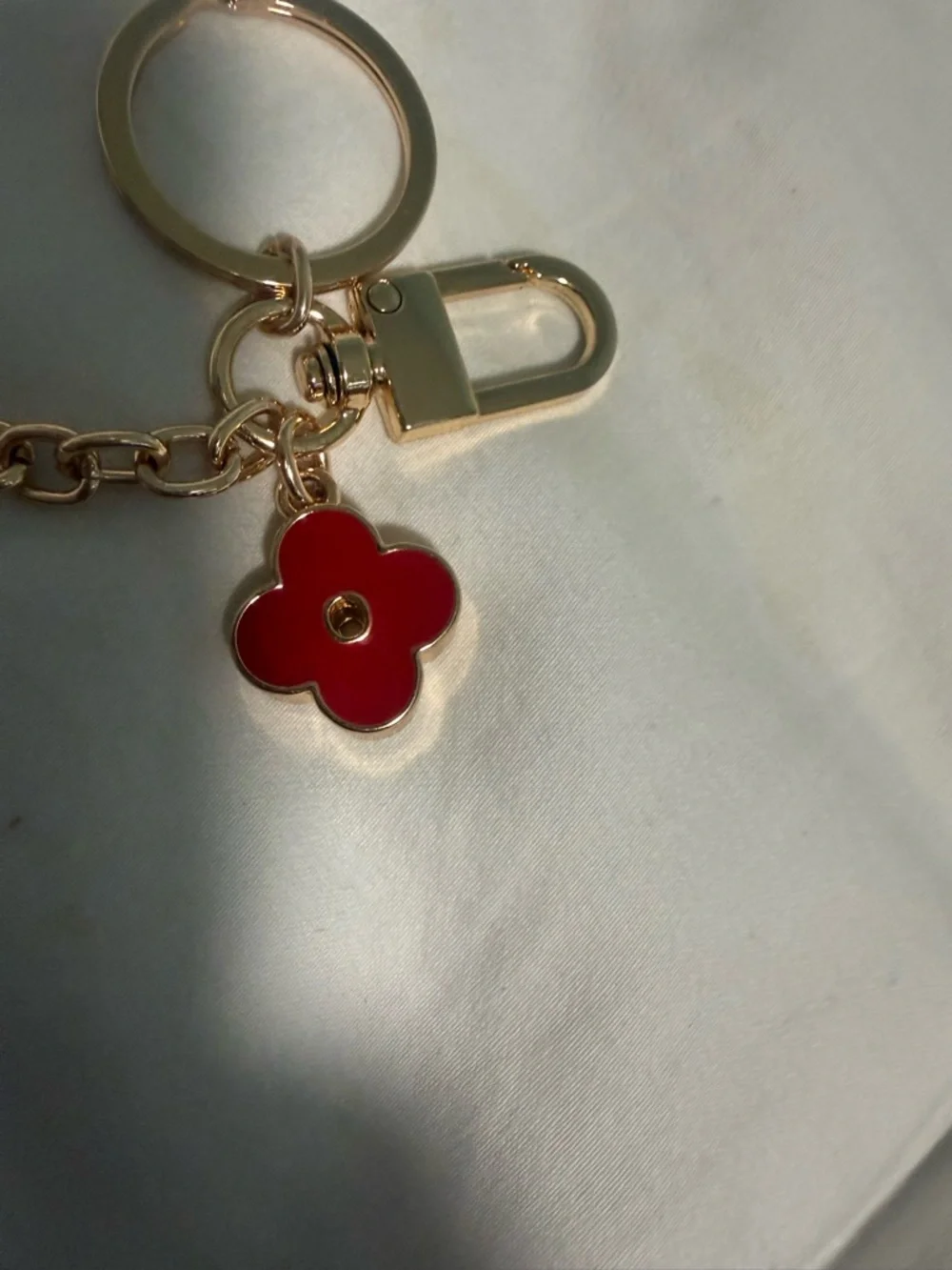 KeyChain with a hook for Bags with Red Flower Charm and gold tone accents!